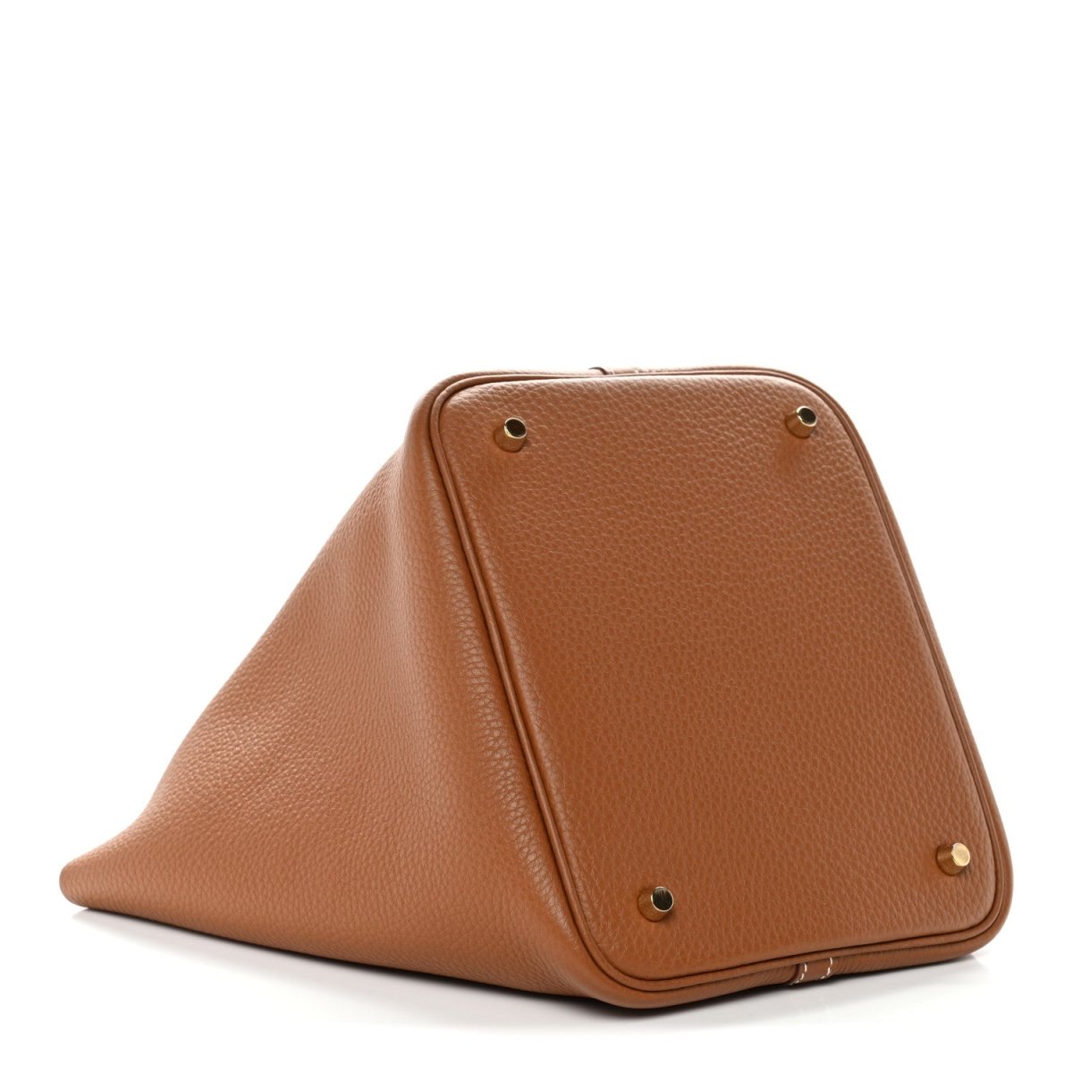 Tan leather bucket bag with triangular silhouette and gold-tone corner hardware