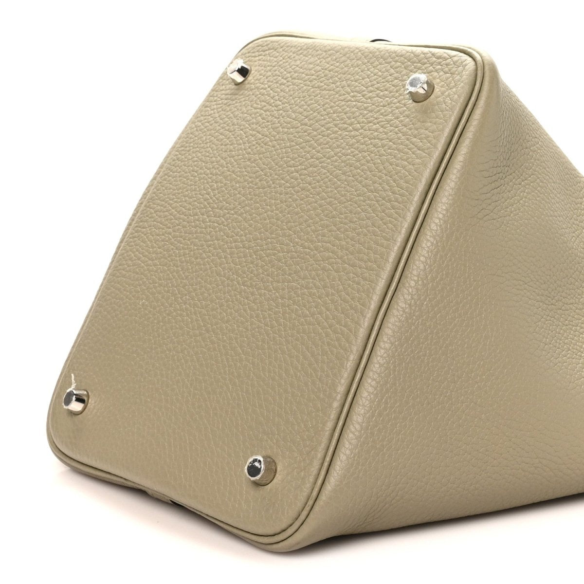 Sauge leather handbag side with rivets and central seam