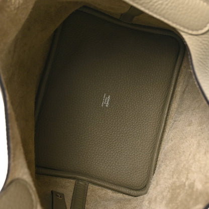 Sauge leather handbag interior with stitched pocket panel