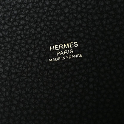 Black leather with embossed “HERMÈS PARIS” and “MADE IN FRANCE” text.