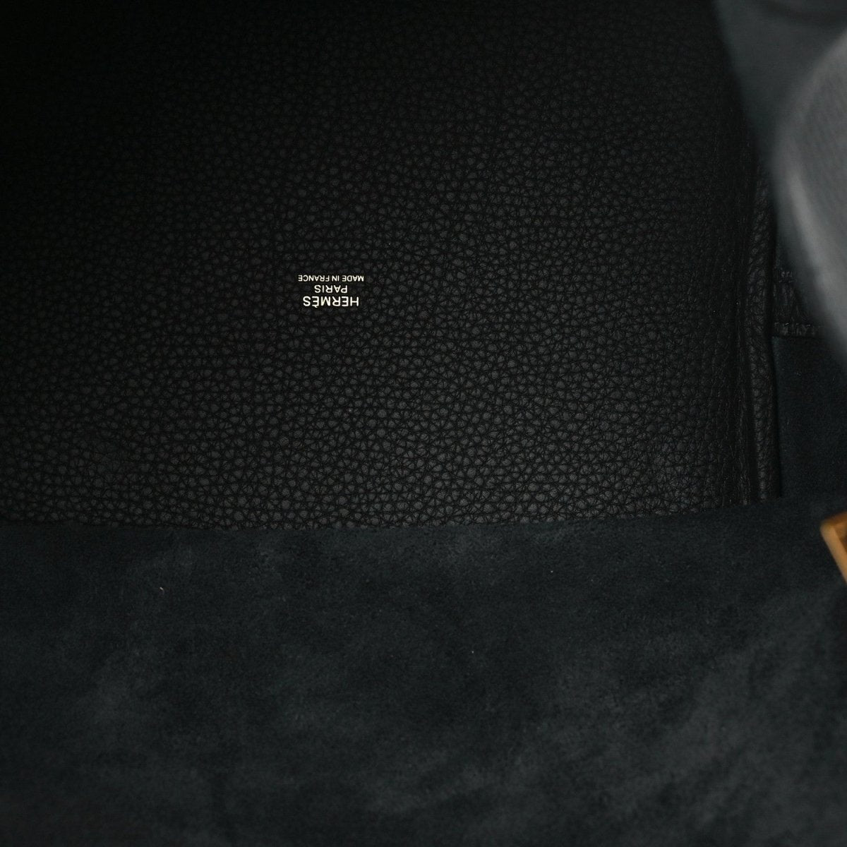 Black leather interior lining with small embossed brand text near the seam.
