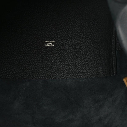Black leather interior lining with small embossed brand text near the seam.