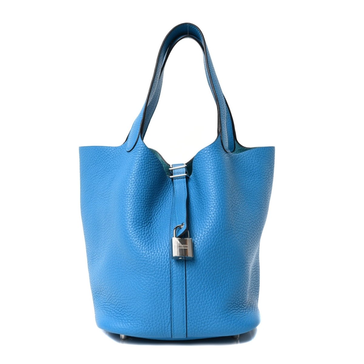 Blue leather tote bag with top handles and central lock clasp, structured silhouette