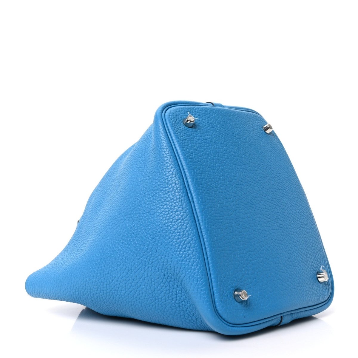 Blue leather handbag with angular shape and silver-tone lock hardware, close-up