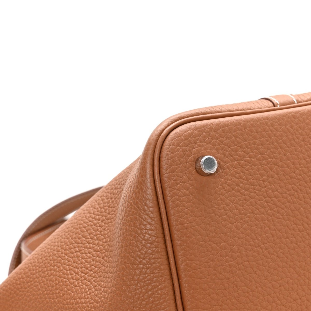 Pebbled tan leather tote with silver lock near the top