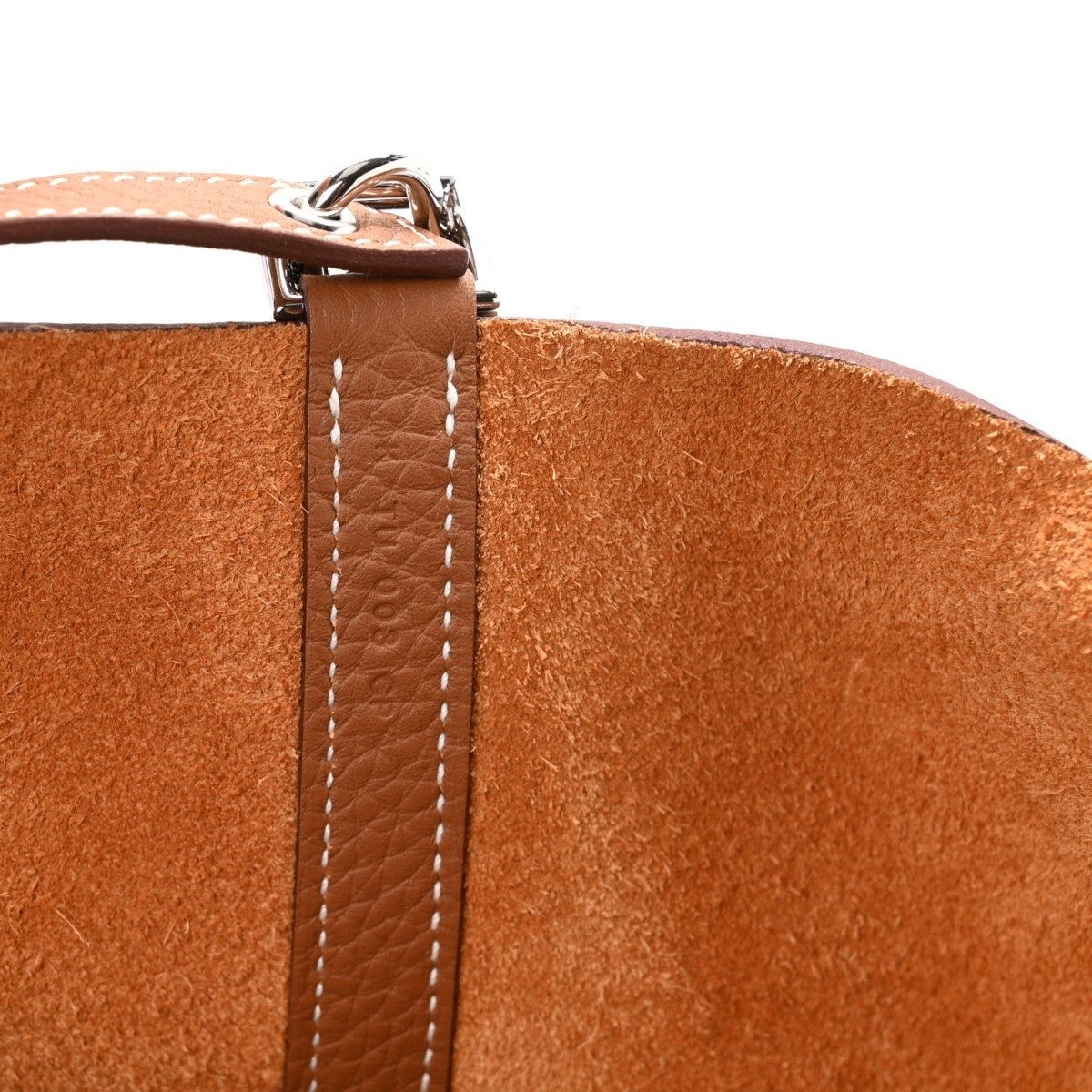Tan leather strap with contrasting white stitching and metal clasp detail
