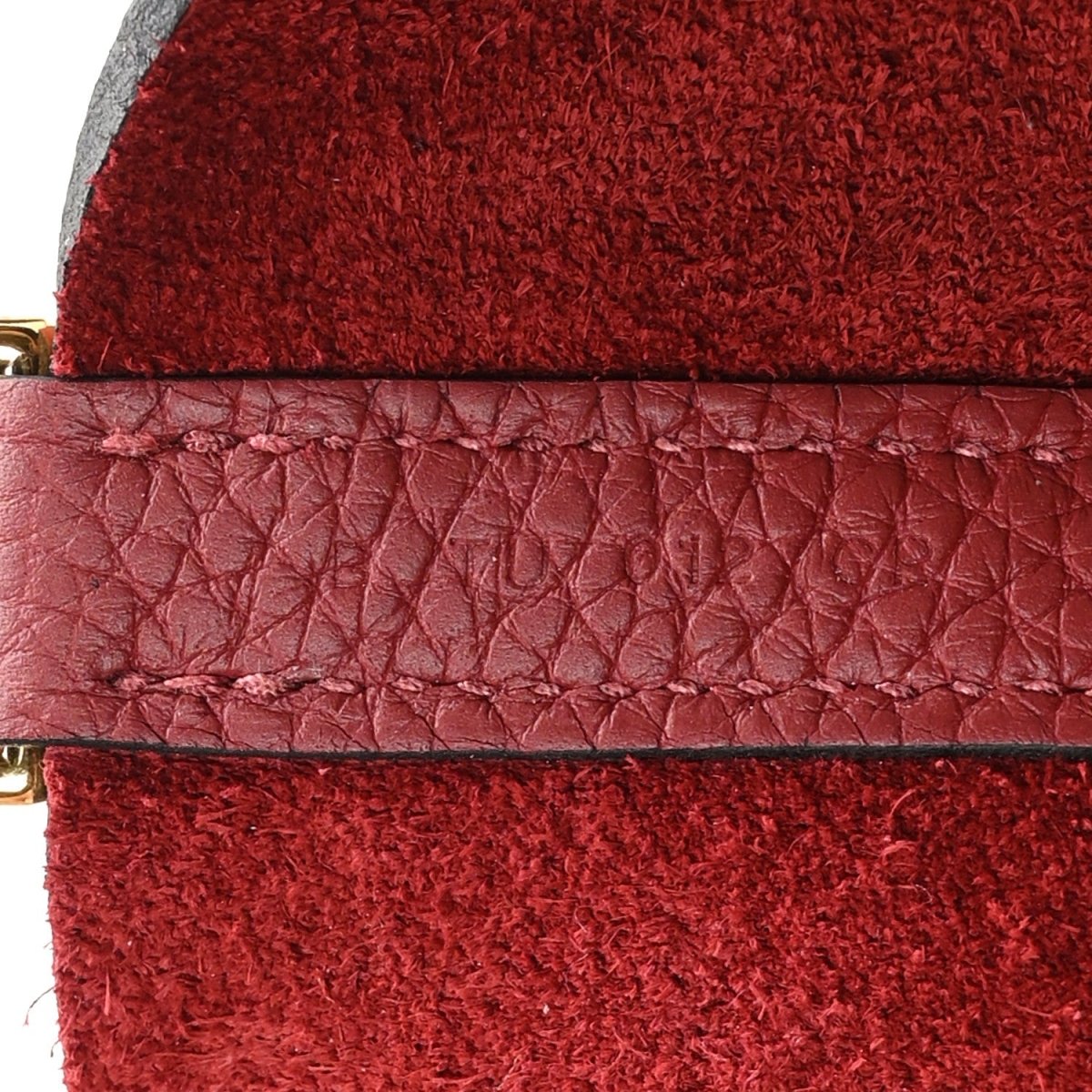 Red suede lining with red leather trim and stitched seam on mini tote
