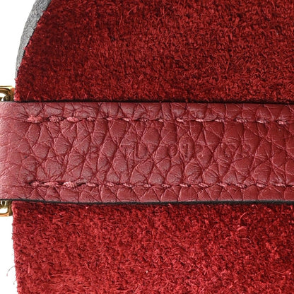 Red suede lining with red leather trim and stitched seam on mini tote