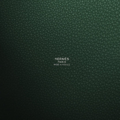 Green leather interior panel with stamped brand and “Made in France” text