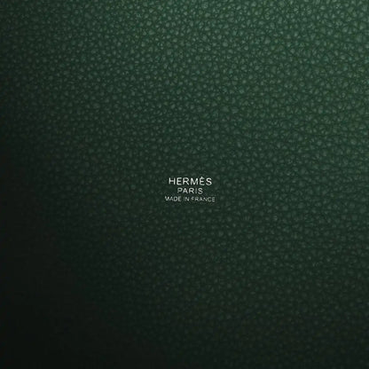Green leather interior panel with stamped brand and “Made in France” text