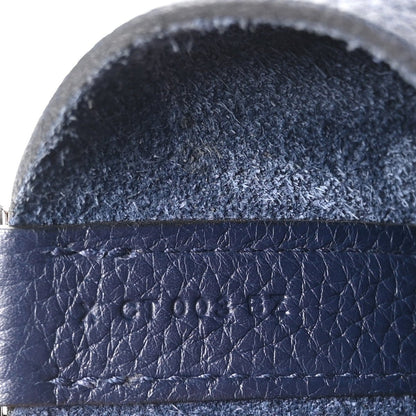 Navy leather strap edge with layered stitching and textured finish