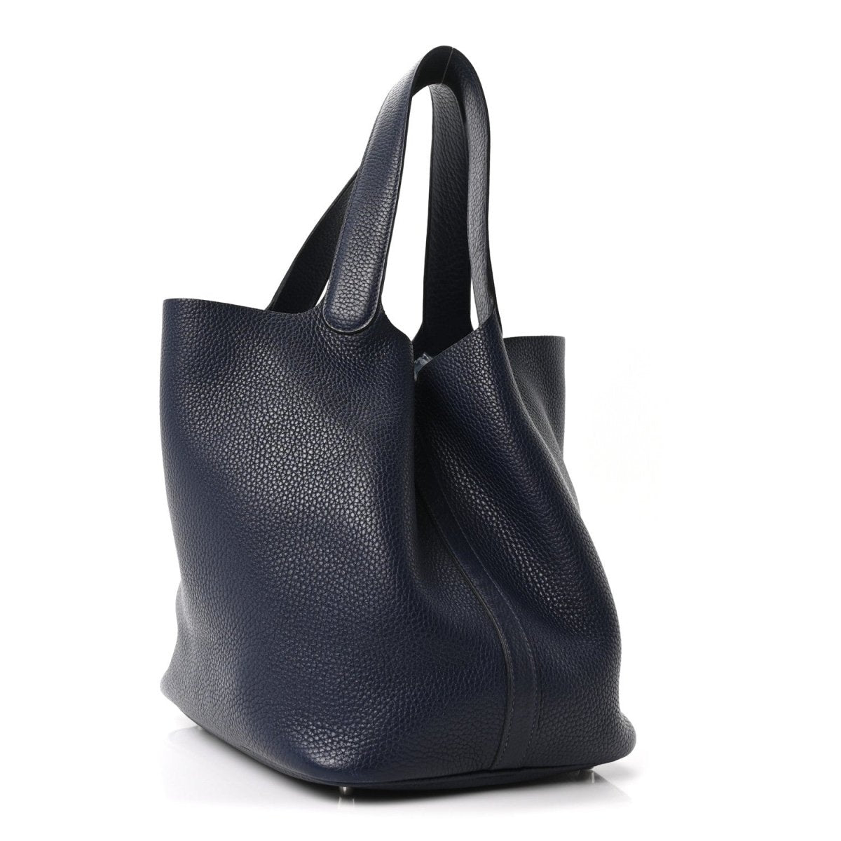 Navy leather tote bag with structured shape, top handles, and side seam