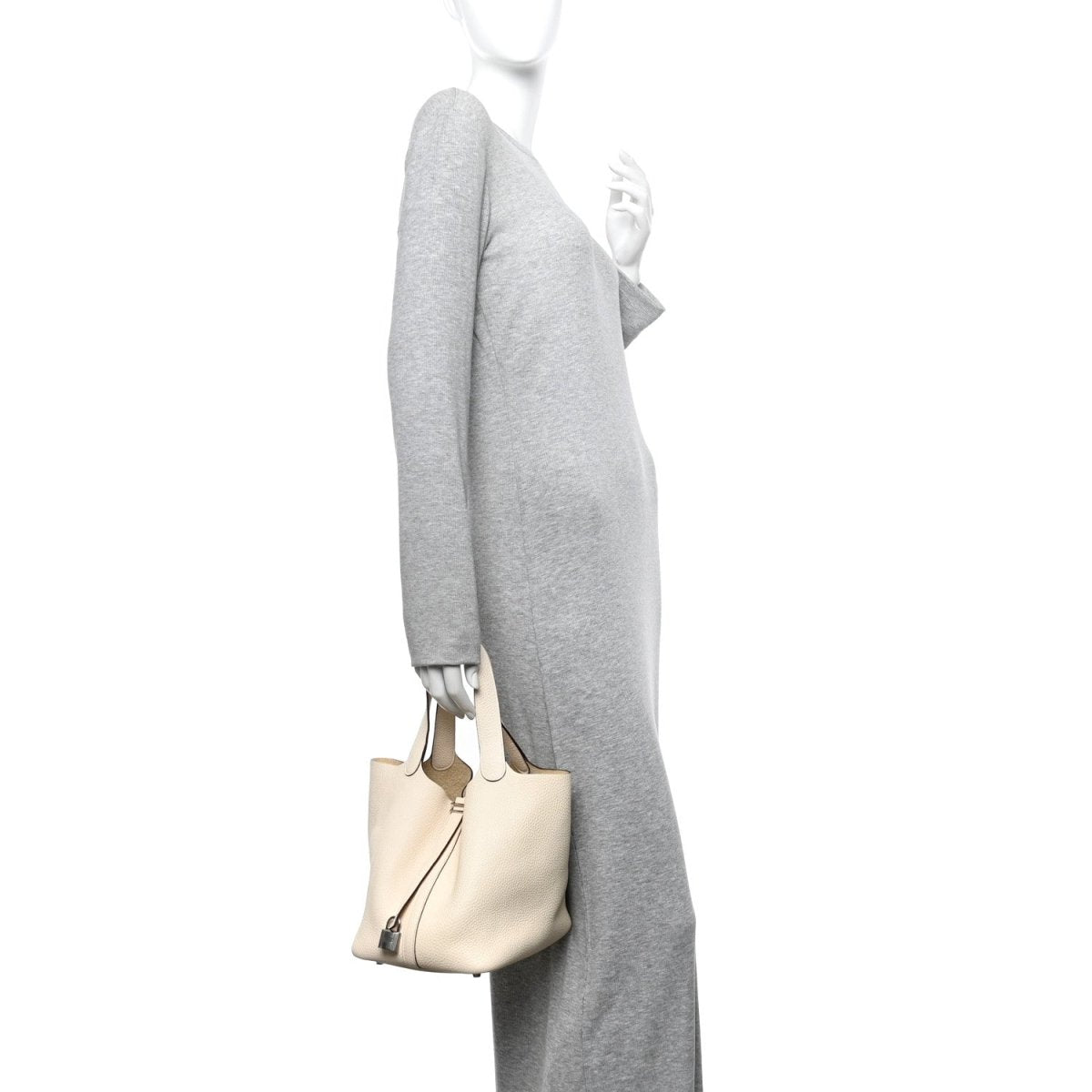 Light beige leather bucket bag with short handles and center lock hardware