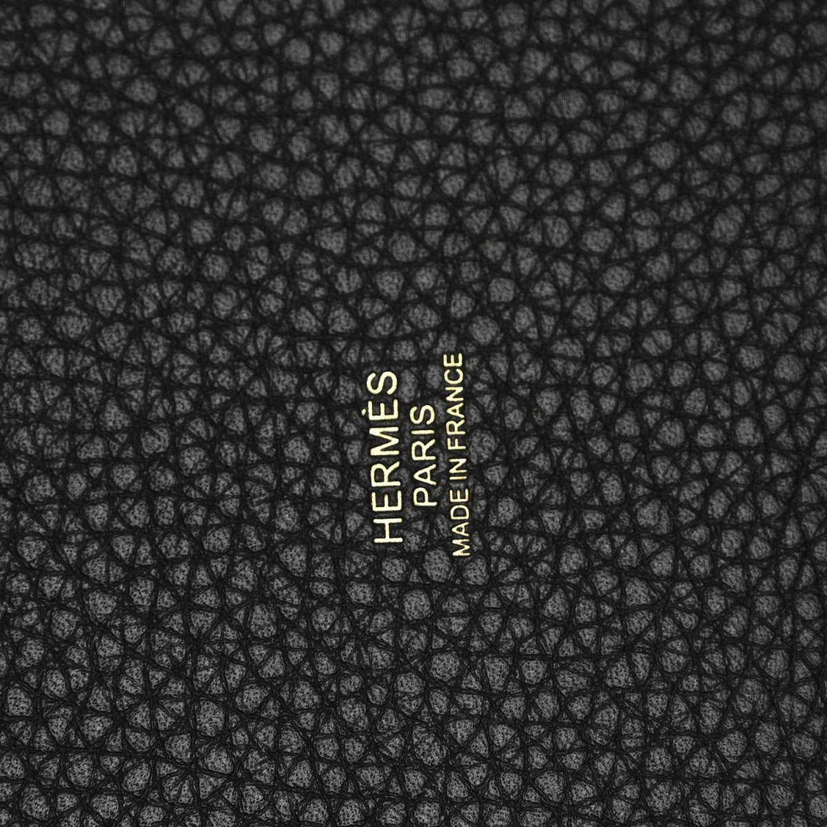 Black leather with Hermès Paris branding logo stamp.