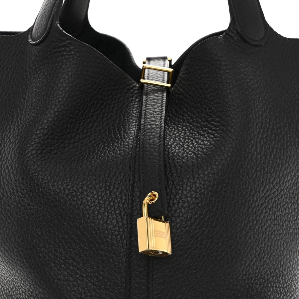 Black leather tote zipper with gold-tone lock and metal pull detail.
