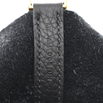 Leather handle tab with stitched edge and gold-tone top hardware loop.