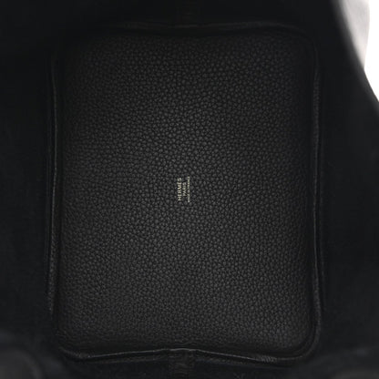 Black leather interior panel with small logo stamp and stitched side seam.