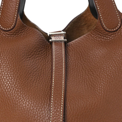 Hermes Picotin lock bag top closure with metal bar and leather strap loops