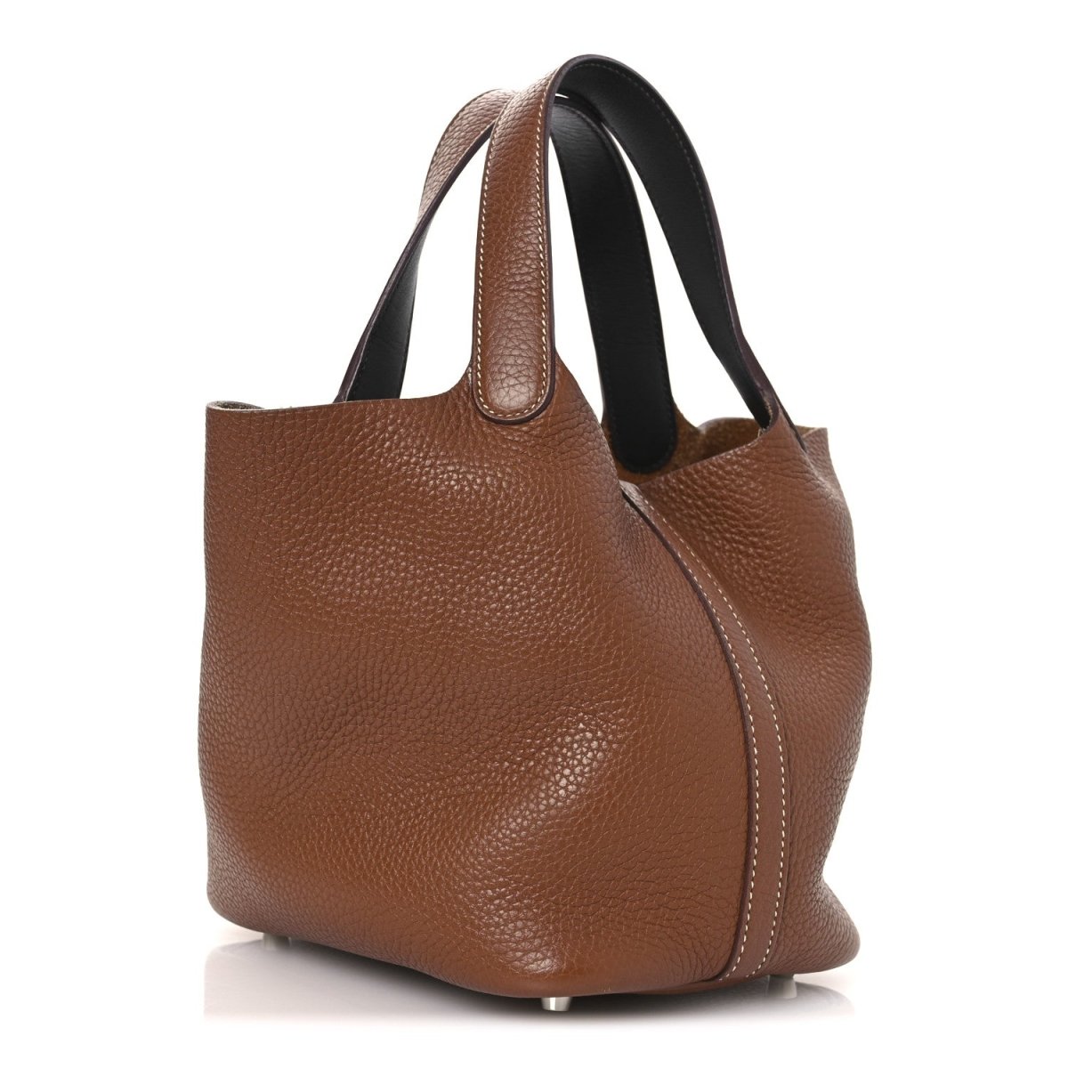 Brown leather tote bag with curved top handles and contrast dark inner lining