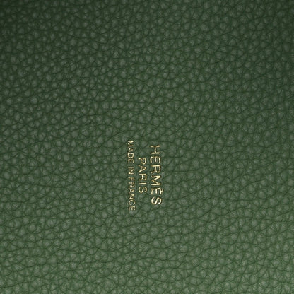 Green pebbled leather interior with centered embossed brand mark