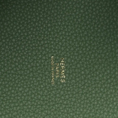 Green pebbled leather interior with centered embossed brand mark