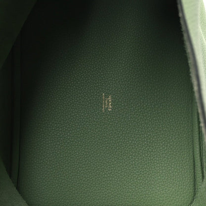 Green leather interior panel with embossed logo text