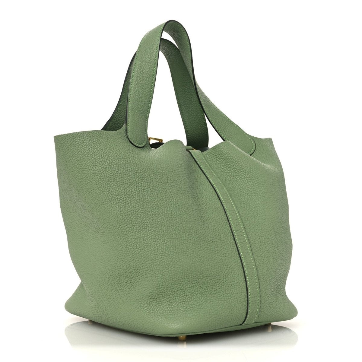 Green leather bucket bag with curved silhouette, top handles, and center seam