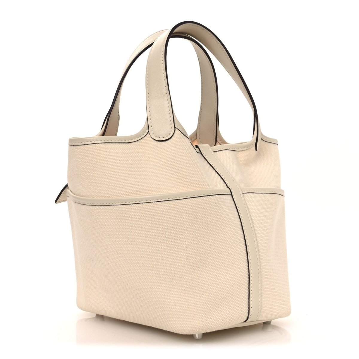 Cream canvas tote bag with top handles and front pocket with lock details