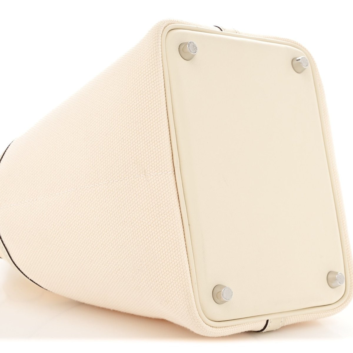Nata tote bag side panel with metal hardware corner details