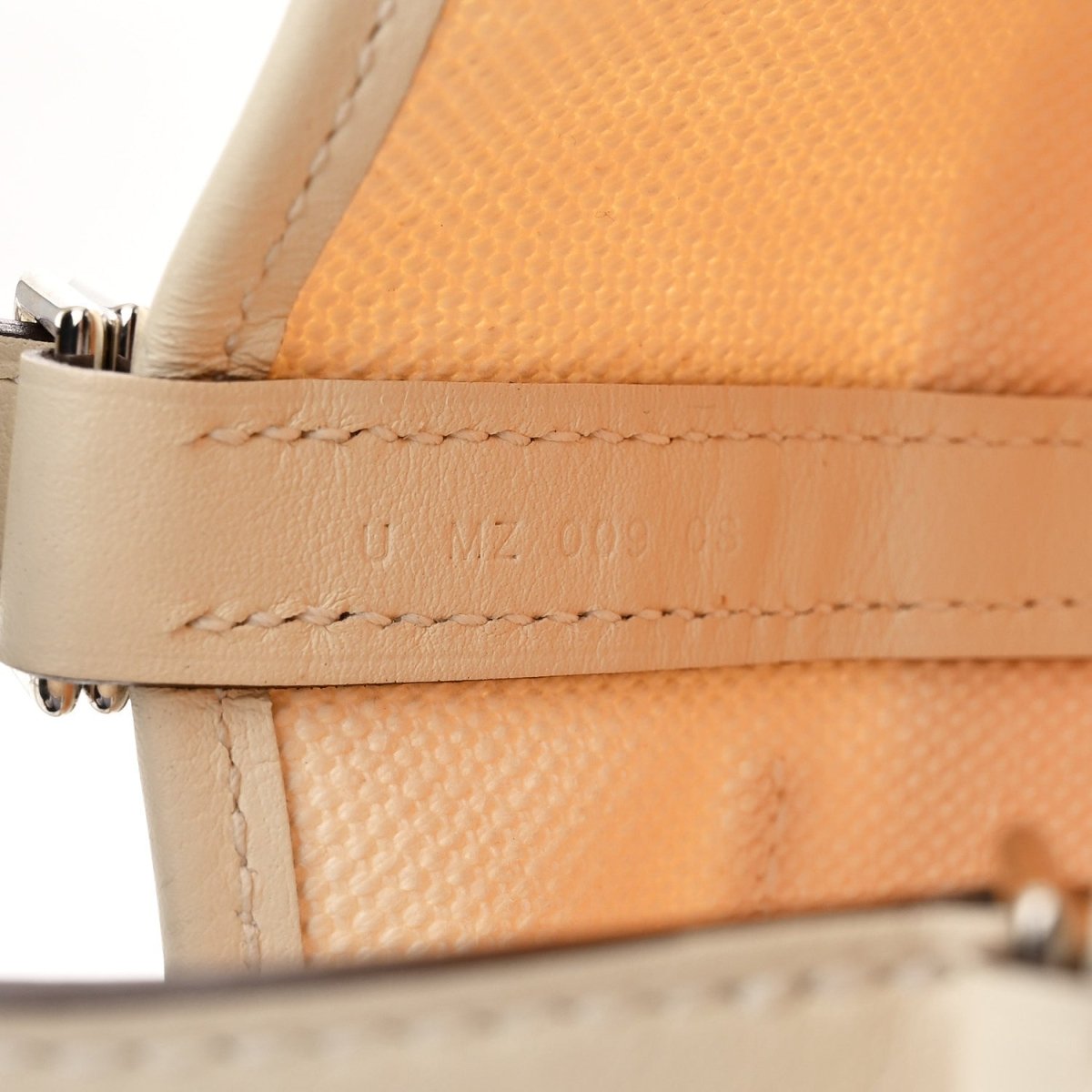 Nata leather trim and stitching detail with metal zipper hardware