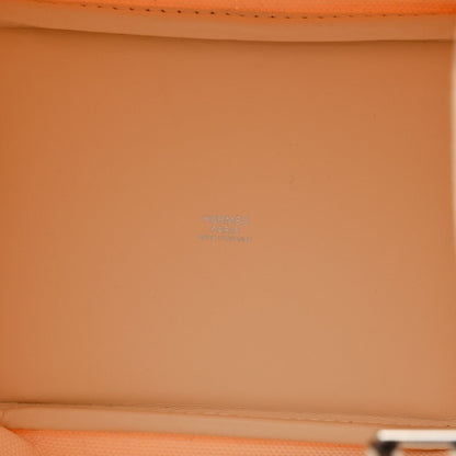 Orange leather interior panel with faint embossed logo